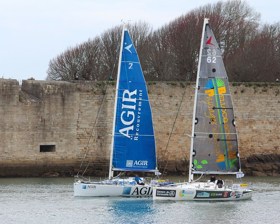 Figaro boats beneath the Concarneau ramparts before the 2016 Transat AG2R