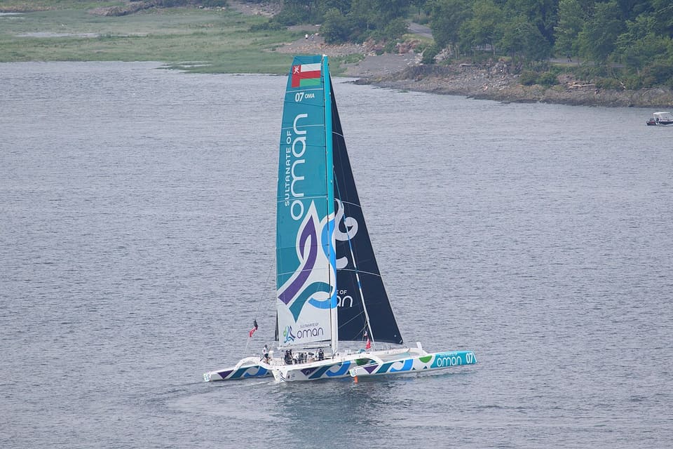 The trimaran Musandam-Oman Sail on the St. Lawrence leaving Quebec City